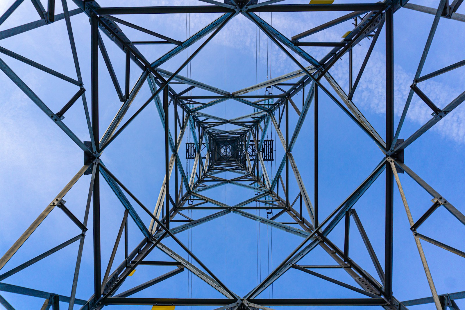 a tall metal structure with a sky in the background